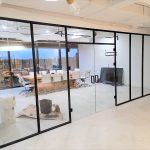 The Benefits of Frameless Glass Partitions in Modern Office Spaces